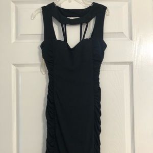 Black bodycon strapped dress with sinching on the sides